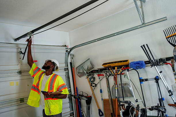 Professional Garage Door Installation technician working in Wellsville, UT